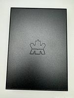 Outer black slipcover with RCM logo