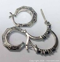 Top view of both earring pairs showing overall shapes and clasps