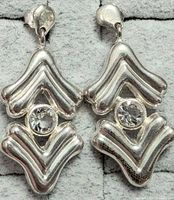 Front view of both silver chevron earrings showing cubic zirconia stones