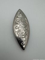 Front view of sterling silver leaf brooch showing etched design