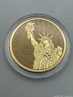 Reverse showing Statue of Liberty and denomination