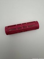 Full view of pink plastic coin roller