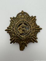 Front view showing design, motto, crown