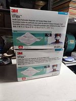 Front view of two sealed 3M VFlex 1804S N95 respirator boxes