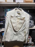 Front view showing blazer design, color and lapel detailing