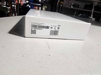 Sealed white ADT touchscreen panel box showing product label with serial number and regulatory markings