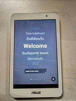 Front of Asus tablet powered on at welcome screen