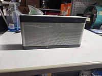 Front view of Bose SoundLink speaker showing silver grille and black panels
