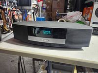 Front view showing display and speaker grille of Bose Wave Radio II