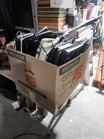 Cardboard box exterior with keyboards visible