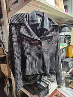 Full view of jacket hanging, shows style and pattern