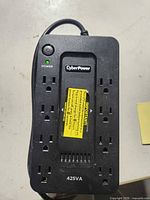 Front view showing CyberPower branding, power button, eight outlets, 425VA marking