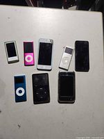 Front view of all eight portable media players