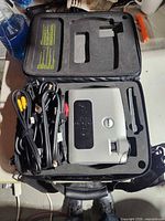 Projector in carry case with bundled cables and remote