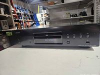 Front view of Denon Blu-ray player, closed tray