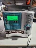 Front view of Aiwa receiver showing display, CD tray closed