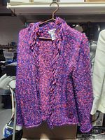 Front view of multicolor knit cardigan on hanger