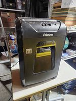 Front and side view of Fellowes shredder showing viewing window and build