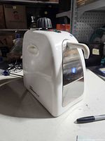 Front angled view of GemOro Brilliant Spa jewelry steam cleaner