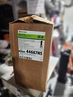 Front view of sealed Halyard case with product label showing model 44667NS, size L, 36 count