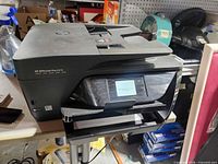 Front and top view of HP OfficeJet Pro 6978 printer powered on
