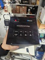 Top control panel showing branding, Bluetooth indicator and buttons