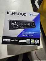 Front of Kenwood KDC-BT268U box showing product image and features