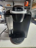 Front view showing overall unit, water reservoir and drip tray