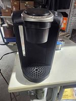 Front view showing overall unit, drip tray and water window