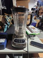 Front view of KitchenAid blender showing base, control panel, pitcher and lid