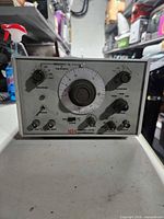 Front view showing frequency dial, controls and branding