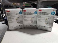 Three unopened 3M 8210 N95 respirator boxes