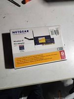 Front of sealed Netgear WG311 Wireless-G PCI adapter box