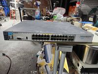 Front view displaying 24 Ethernet ports, uplink ports and console