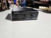 Front view showing RadioShack branding and three channel buttons