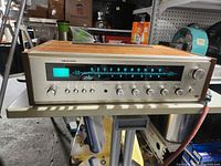 Front and top view of Realistic STA-75 receiver showing overall condition and wood cabinet