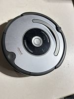 Top view of iRobot Roomba robotic vacuum cleaner, charger absent