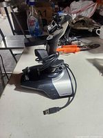 Front view of Saitek Cyborg Evo joystick with USB cable