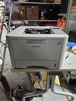 Front view of Samsung ML-3312ND printer on table