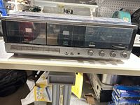 Front view showing dual cassette deck, control buttons and knobs