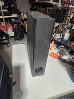 Front of slim black Sony subwoofer cabinet