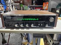 Front view showing Sony branding, controls and illuminated tuning scale