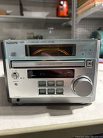 Front view of Sony HCD-RB5 unit showing controls and CD slot