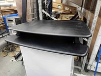 Front view showing two-tier Varidesk converter on cabinet