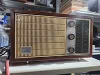 Front view of Bradford radio showing grille, dial and knobs