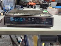 Front view showing LED display, GE logo, frequency scale