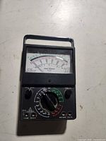 Front view showing meter face, rotary selector and missing leads