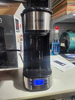 Front view of Wirsh coffee maker showing overall design and box in background