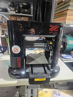 Front view of XYZprinting da Vinci mini W 3D printer on table