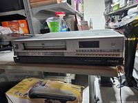 Front view showing Zenith VHS VCR, tape slot, controls and branding